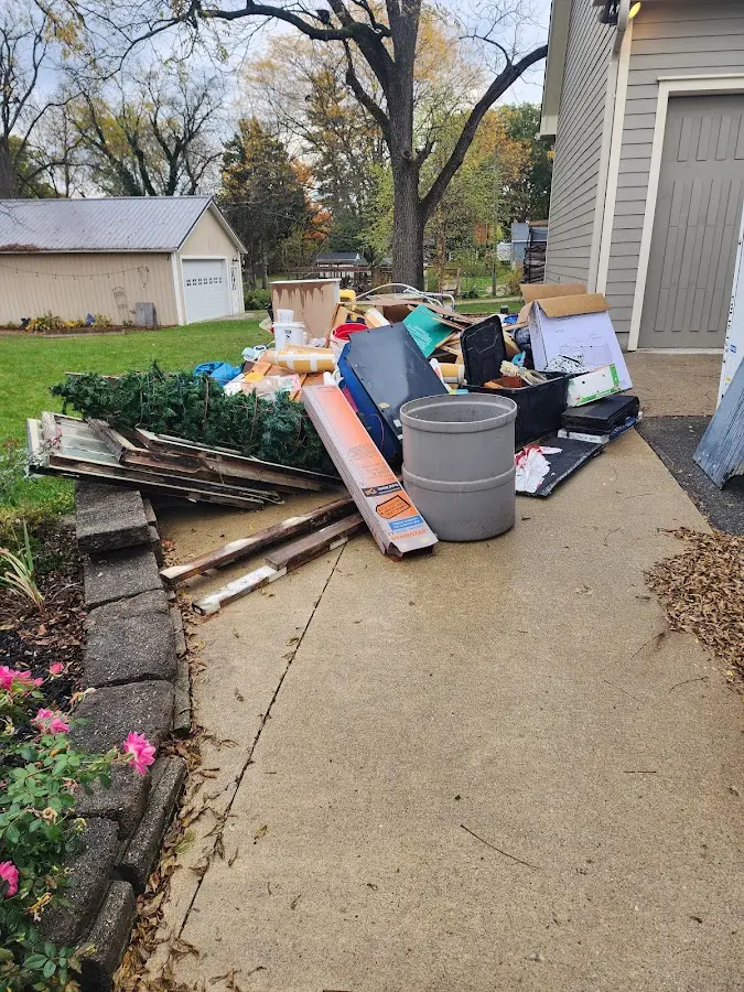 Dumpster being loaded with debris for Demolition Dumpster Rental in LaGrange